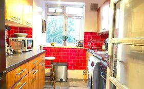 Room With King Size Bed And Shared Kitchen